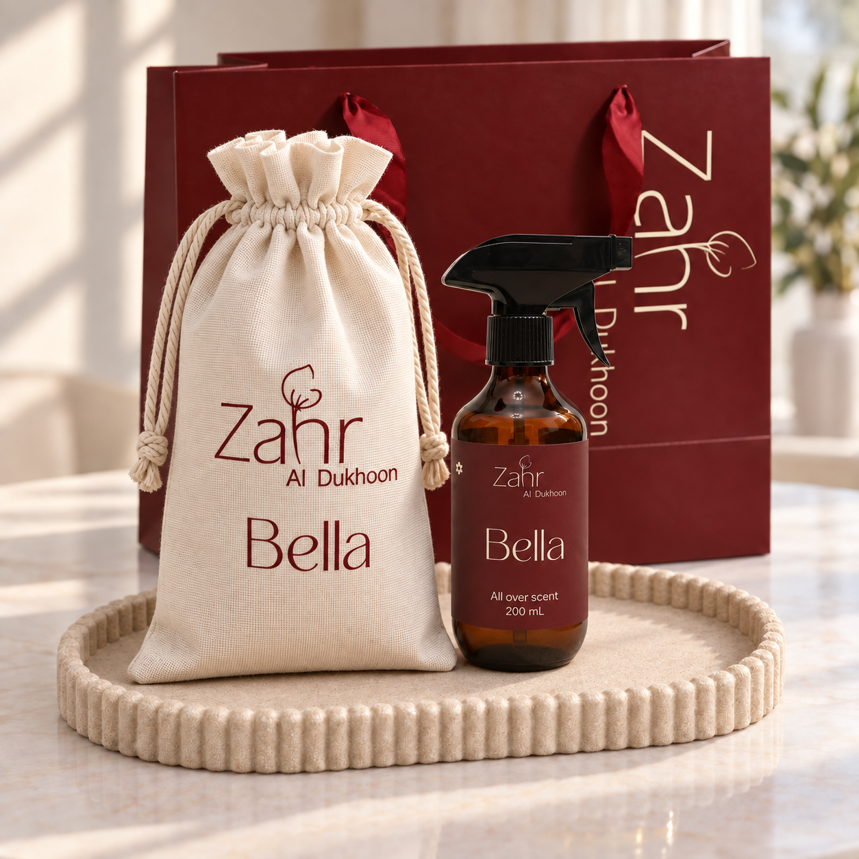 Bella 200 ml spray bottle with a named tall pouch and maroon Zahr shopping bag